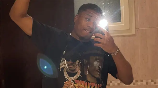 Montel McKenzie taking mirror selfie in a bathroom