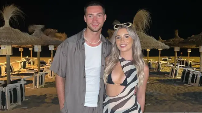 Ron Hall and Lana Jenkins on the beach at night time