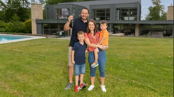 Will Satherley and his wife Carrie outside their new Cotswolds home with their two sons