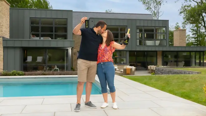Will and his wife Carrie celebrate with a kiss outside their £3.5million home
