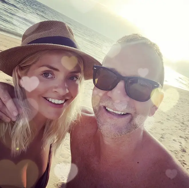 Holly Willoughby smiles alongside her husband Dan Baldwin during a family holiday