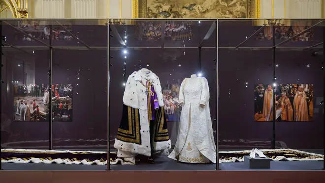 The King and Queen's coronation robes on display at Buckingham Palace ready for the summer opening to the public