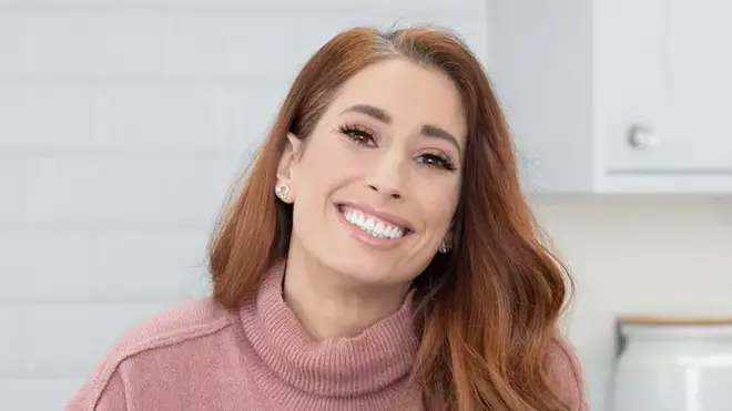 Stacey Solomon wearing a pink roll neck jumper and smiling