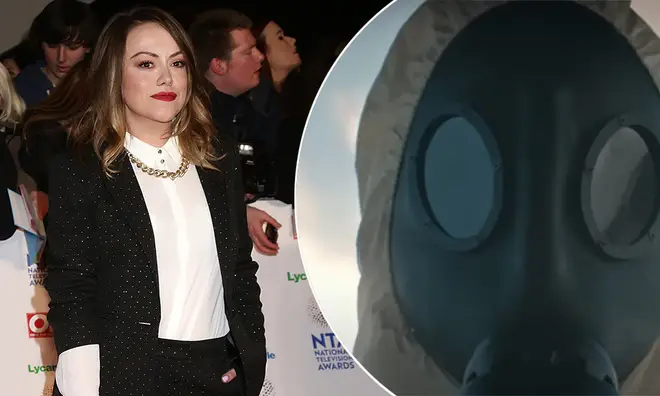 Sian Reese-Williams wearing a black suit and white shirt at the NTAs alongside a picture of a man in a mask from Wolf