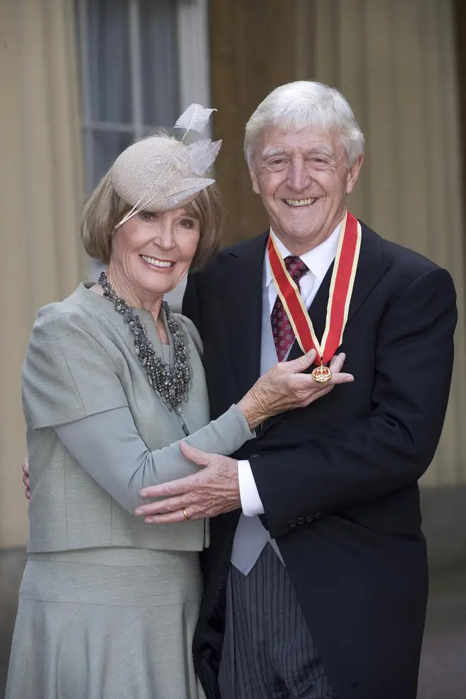 Sir Michael Parkinson is pictured with his wife Mary after receiving  his Honour of Knighthood from Queen Elizabeth II, 2008