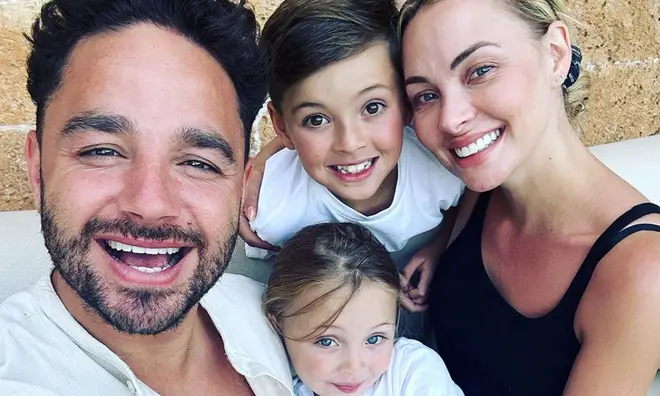 Adam Thomas and wife Caroline have been cuddling children Teddy and Elsie on holiday