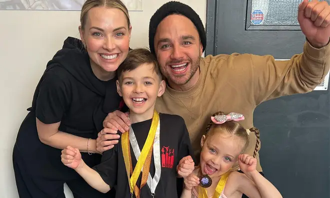 Elsie and Teddy Thomas winning medals for dance and drama with their proud parents Adam and Caroline