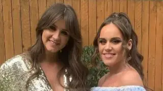 Brooke Vincent and Ellie Leach dressed in party dresses in a garden