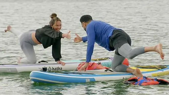 Paul and Natalie went paddle boarding together. 