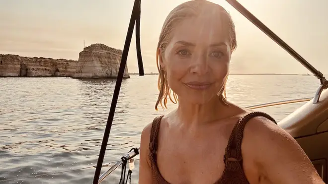 Holly Willoughby poses on a boat during her Italy trip with husband Dan Baldwin
