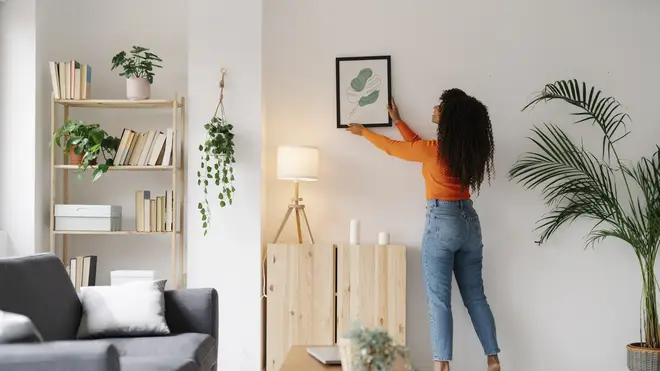 Hanging up pictures which hold a special meaning to you can instantly make you feel more connected to your home