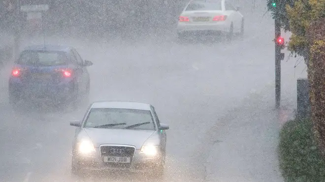 Cars driving in really heavy rain