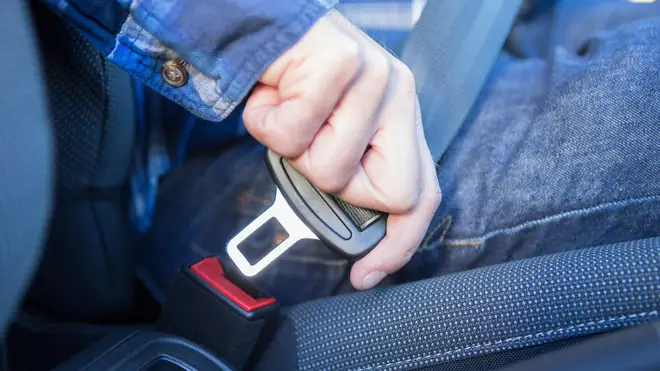 Close Up Of Person In Car Fastening Seat Belt [stock image]