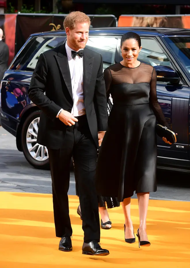 Meghan Markle wore a black midi dress with sheer sleeves for the premiere