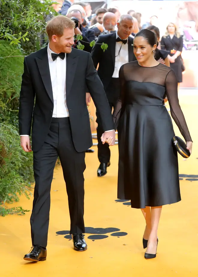 The couple walked the yellow carpet hand-in-hand