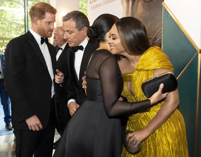 The Duchess of Sussex and the US superstar embrace at the glittering event in London.
