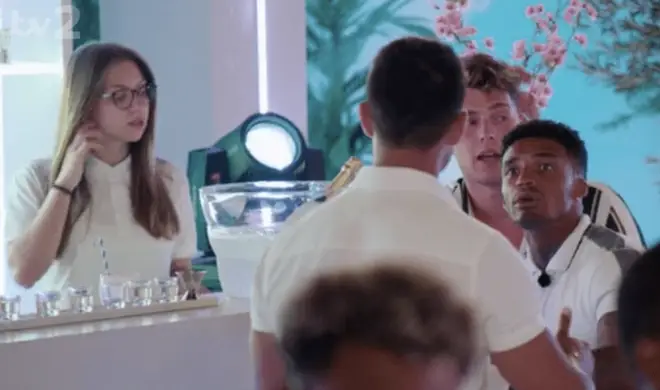 The bar girl was seen right behind Anton and the boys in many of the scenes