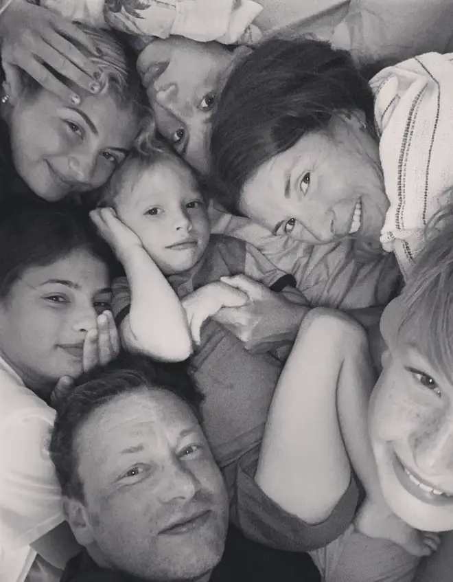 Jamie Oliver smiles with his children and wife Jools Oliver