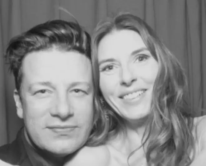 Jamie Oliver smiles with Jools Oliver