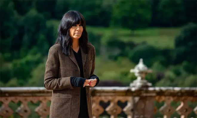 Claudia Winkleman at the front of The Traitors castle