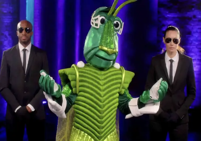 Cricket poses with body guards on The Masked Singer