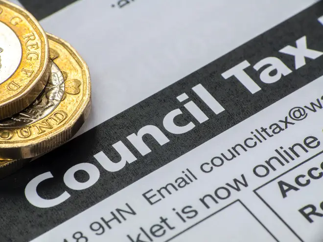 Council tax bill with pound coins