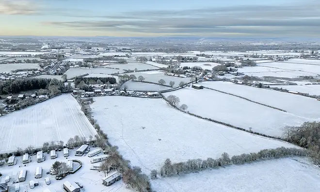 Aerial shot of snow covered fields in the UK