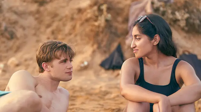 Leo Woodall and actress Ambika Mod beach scene from One Day