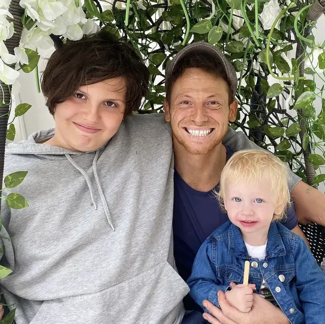 Joe Swash smiles with sons Harry and Rex