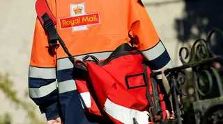 Postman from Royal Mail delivering post