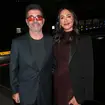 Simon Cowell has been seen with orange glasses recently. Pictured with his fiancé Lauren Silverman