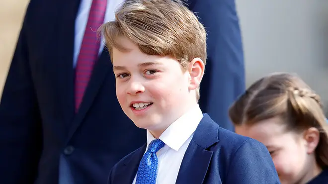 Prince George wearing blue tie and suit