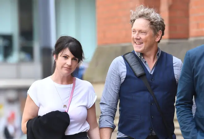 Mark smiles with partner Laura Norton after being cleared of assault earlier this month