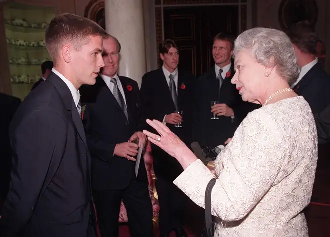 Ascot wasn't the only time Michael met the queen, pictured meeting Her Majesty in 1998