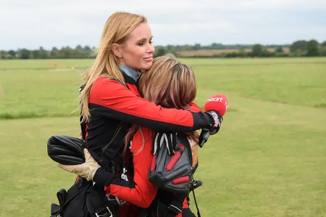 Amanda hugs Charlotte, 17, who was doing the jump in memory of her late mum