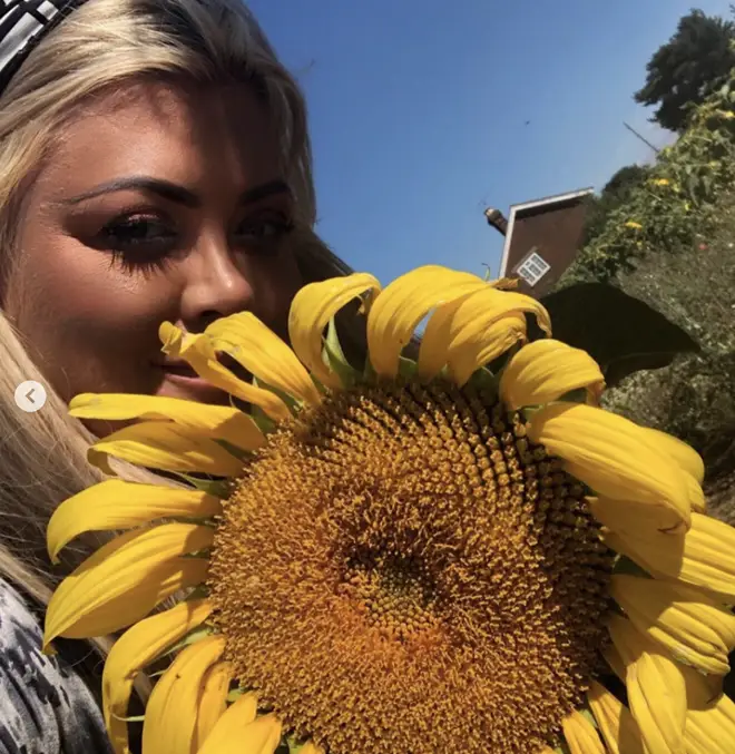 Gemma posed with a sunflower for a sunny snap
