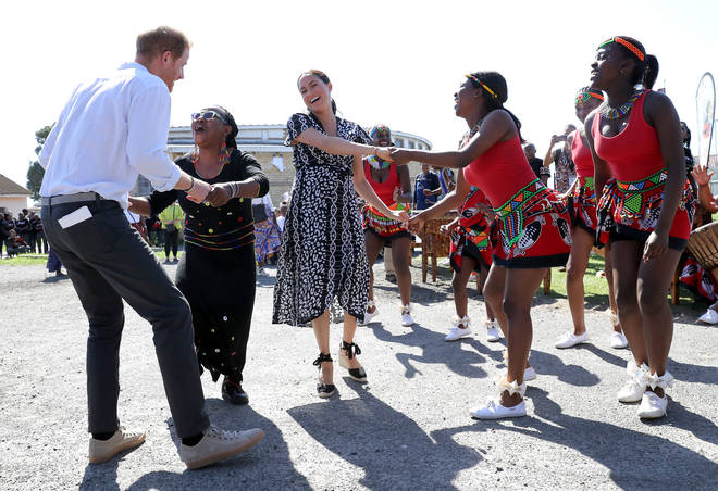 Prince Harry and Meghan Markle were all giggles as they danced with the professionals
