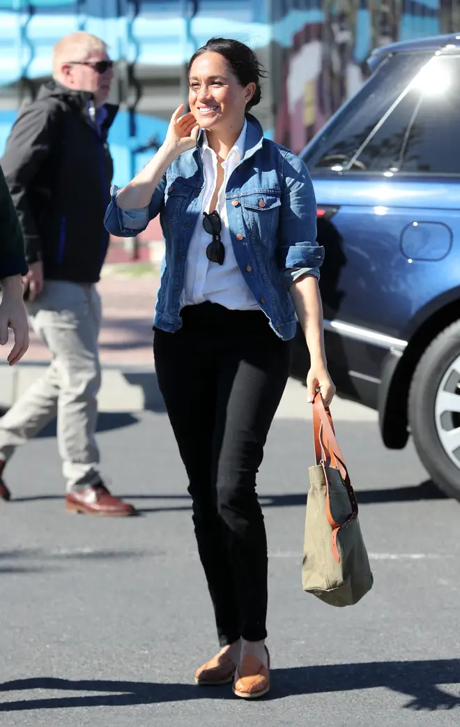 The Duchess of Sussex teamed a white shirt with a Madewell denim jacket