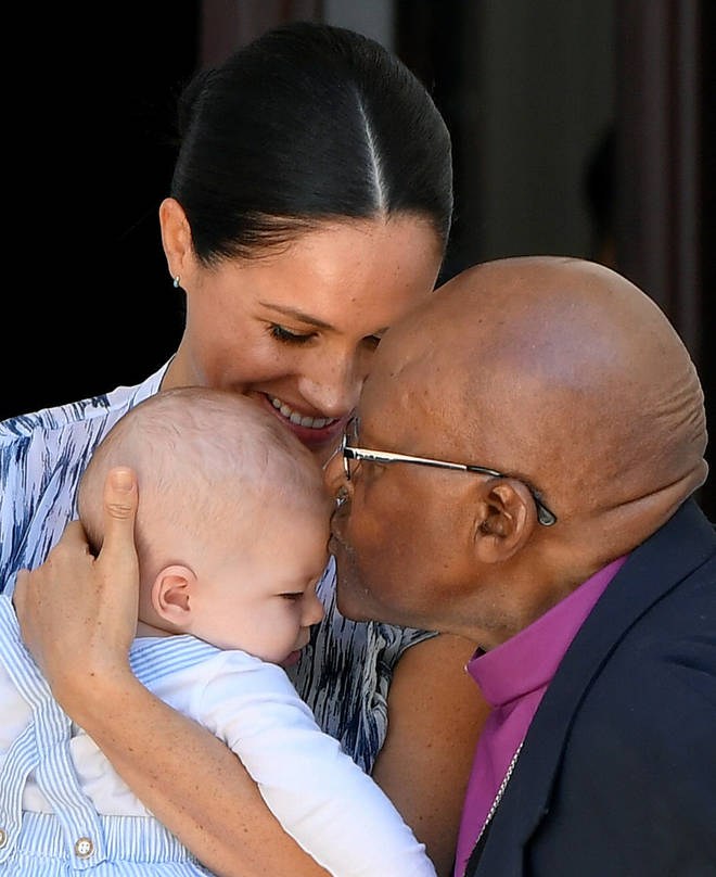 The little royal received a kiss on the head from Archbishop Desmond Tutu