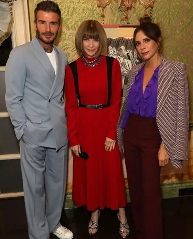 Victoria's had her implants removed since (pictured here with husband David and Anna Wintour)