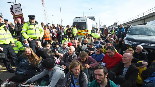 Extinction Rebellion are blocking the main entrance of London City Airport