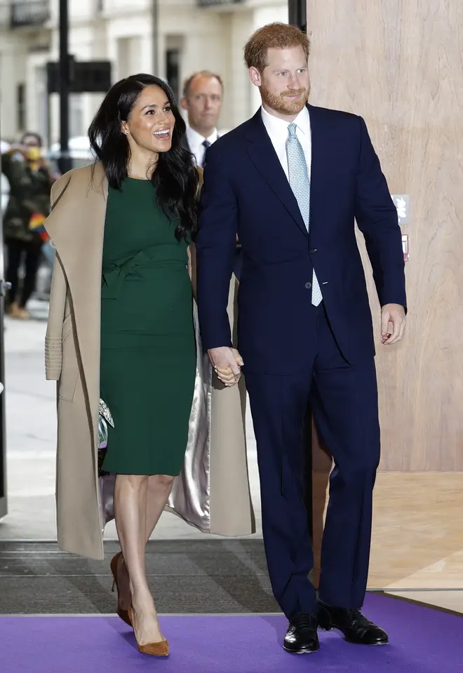 Meghan paired the dress with a light brown jacket and some tan heels