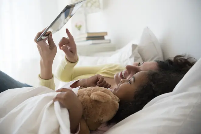 Some parents said they were 'too tired' to regularly read to their kids (stock image)