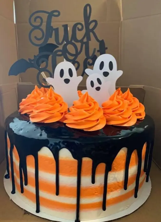 The Halloween cake topper looks like it says something very different than intended