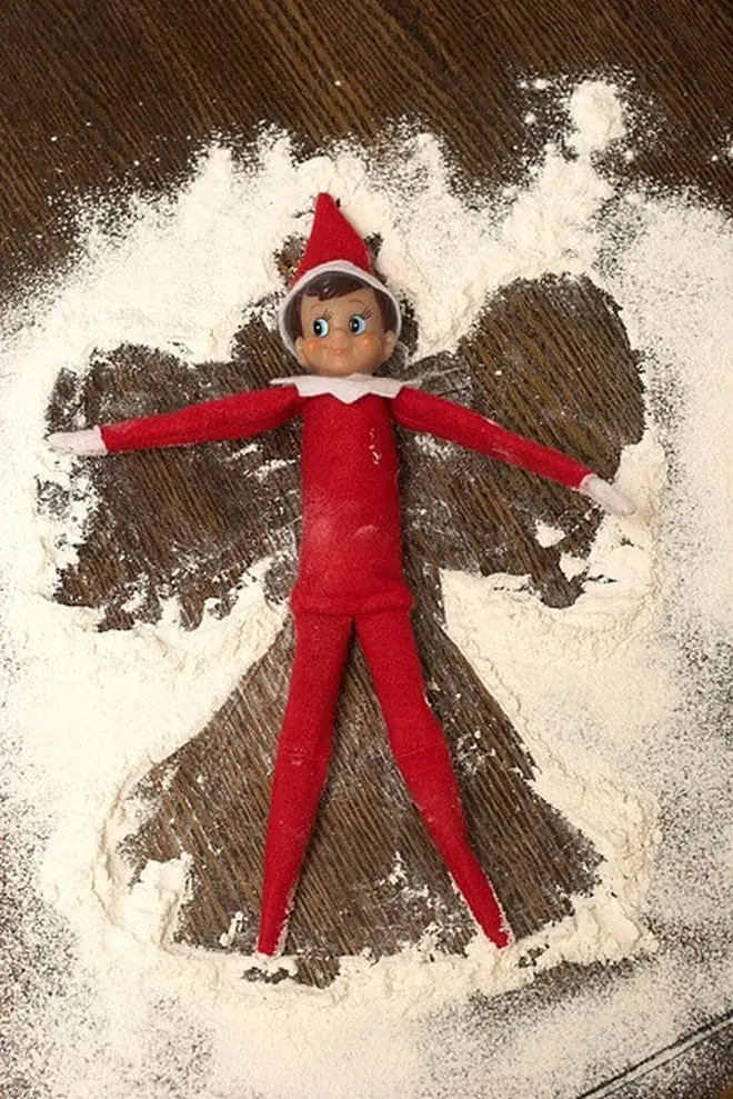 Elf knows how to make the best snow angels with flour.