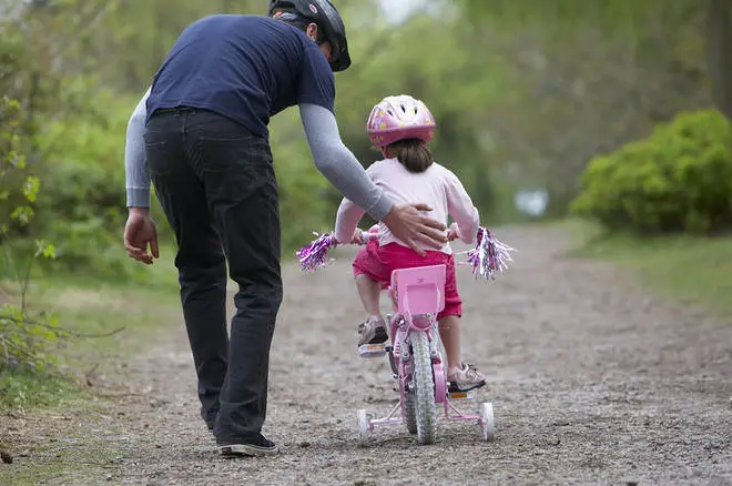 You'll need patience when teaching a child to ride a bike