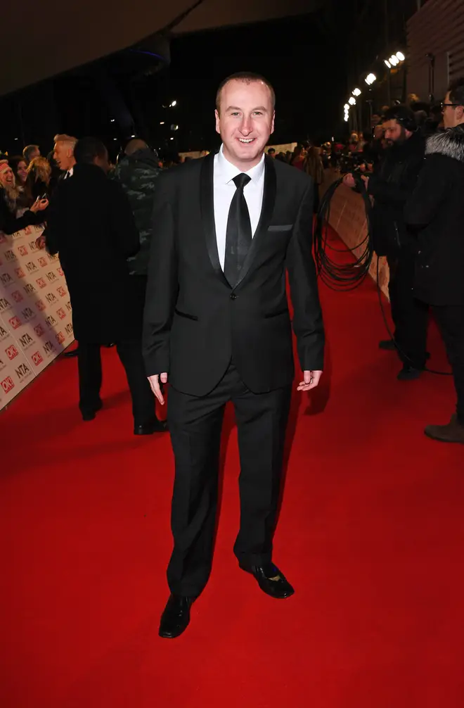 Andrew pictured looking suited and booted at a glitzy showbiz event